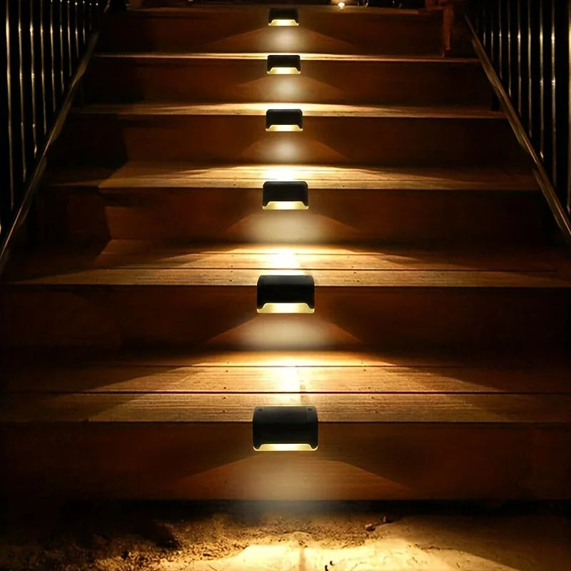 4-Pack LED Solar Stair Lights – Waterproof, Energy-efficient lights for outdoor steps, gardens, and terraces. Easy to install, perfect for adding a warm glow to pathways and borders!